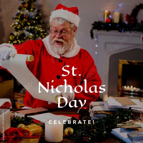 Composition of st nicholas day text over santa claus holding scroll photo