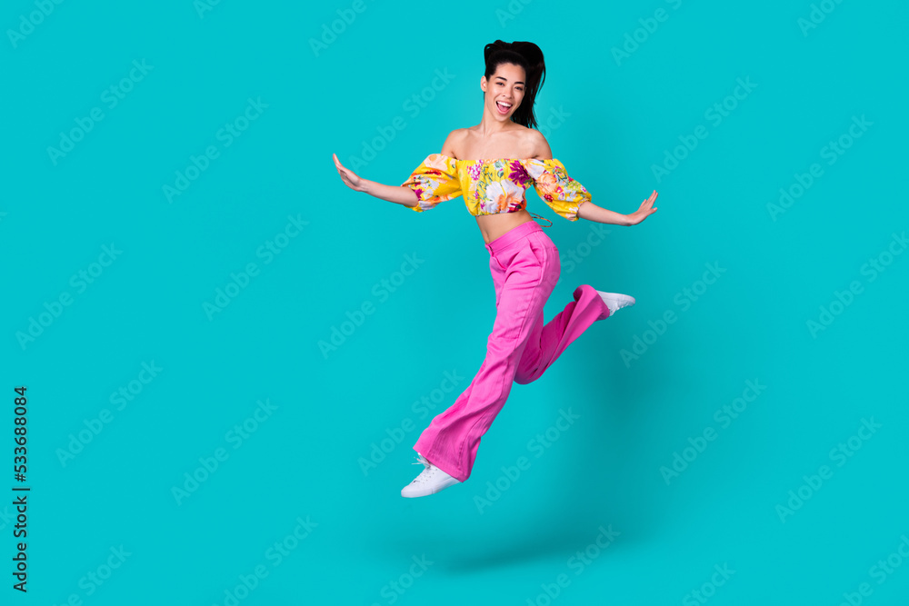 Full length photo of young japanese crazy woman running air summertime vacation isolated on aquamarine color background