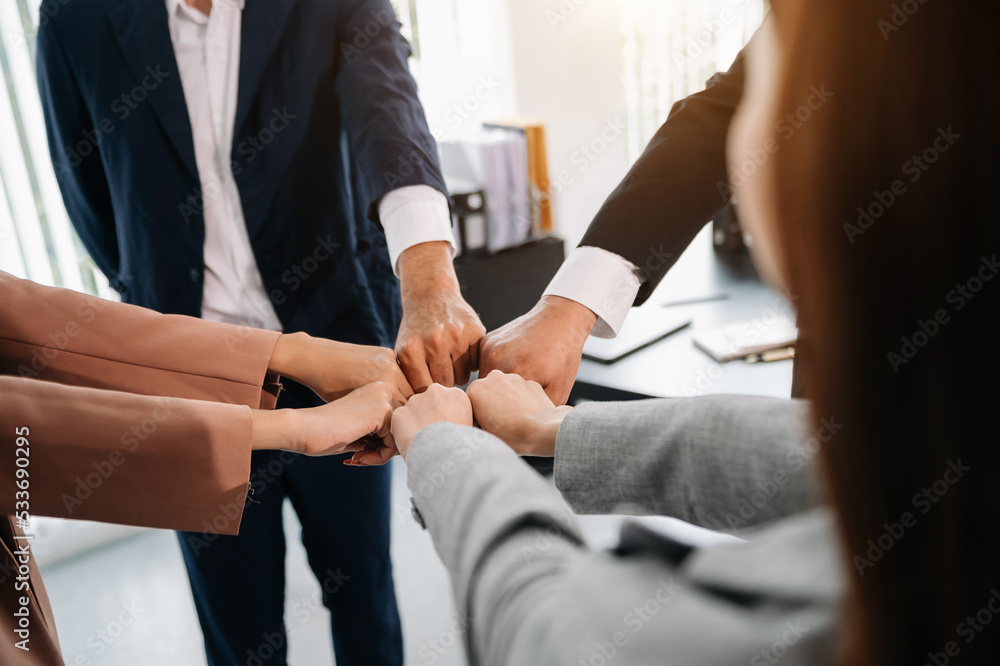 Close up on hands of business people join together their hands together on unity concept . Close up on hands of business people join together their hands together on unity concept .