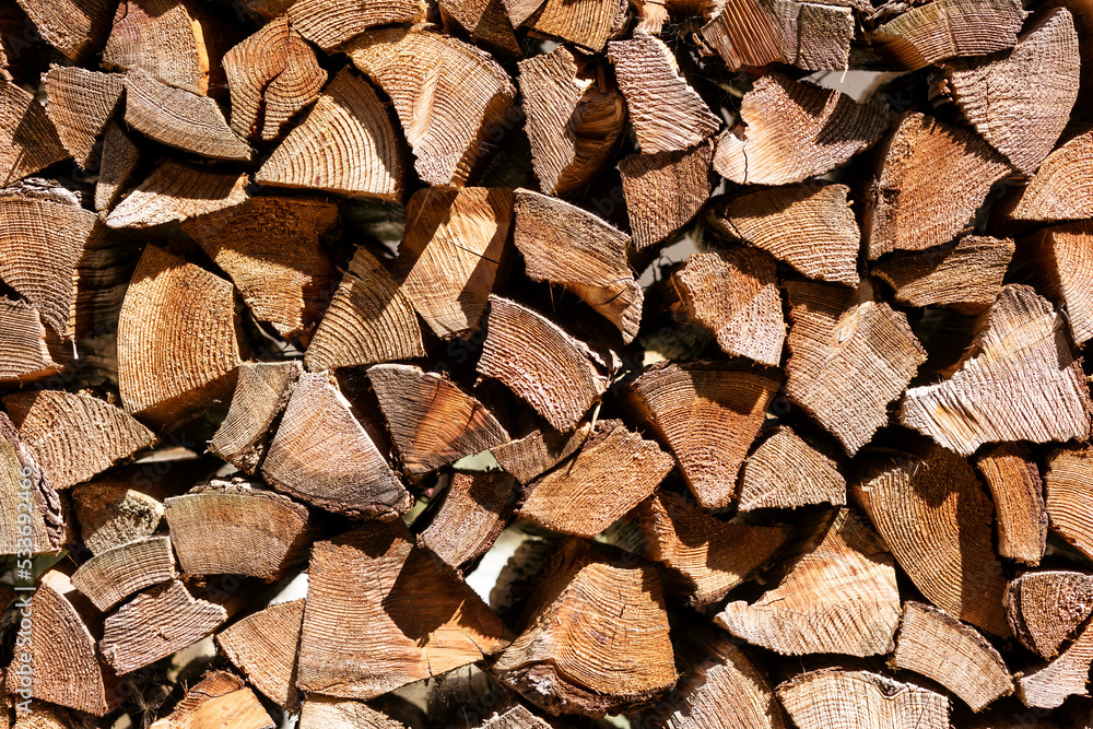 Firewood Background. Chopped Wood Alternative Fuel. Woodpile Stacked. Firewood Background. Chopped Wood Alternative Fuel. Woodpile Stacked.