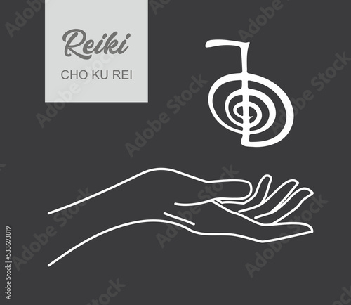 Reiki symbol. A sacred sign CHO KU REI. A hand holds Reiki CHO KU REI sign on a black background. Alternative medicine.