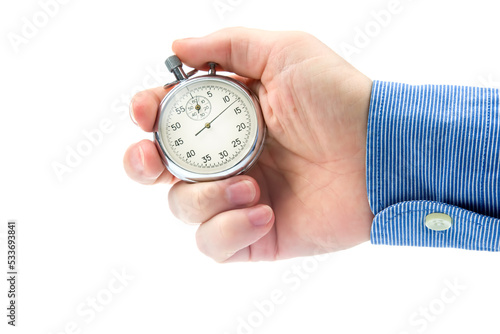 hand with a mechanical stopwatch on a white background. Time part precision. Measurement of the speed interval