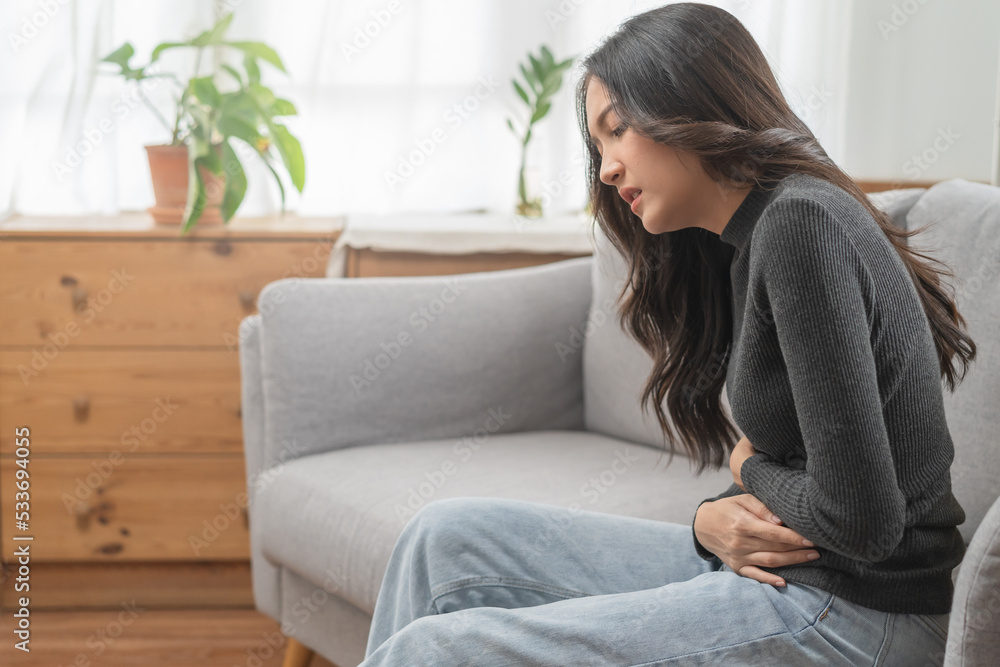 close up woman suffering stomach pain from food poisoning. close up woman suffering stomach pain from food poisoning.