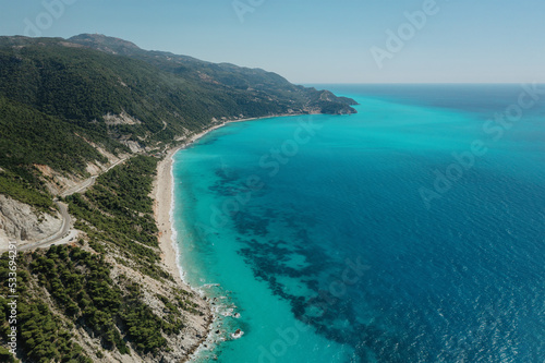Fototapeta Naklejka Na Ścianę i Meble -  Seascape and sandy beach with turquoise clear waters and trees in Greece