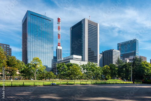 Tokyo  Japan - 09.14.2022  Modern skyscrapers in the center of Tokyo viewed from Hibiya Park. Beautiful sunny day in the downtown of Japanese capital.