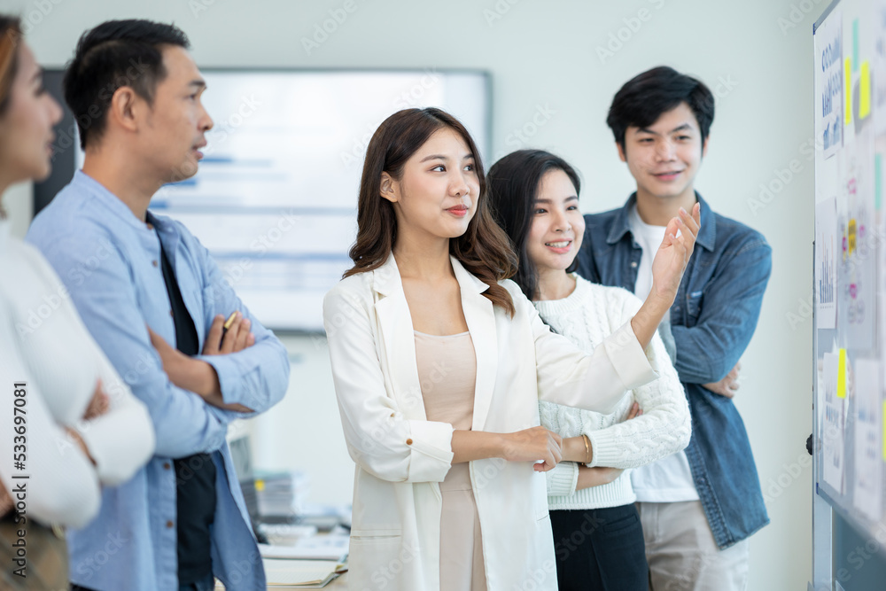Group of young and energetic Asian business are meeting to start a new project in the company data is analyzed in different part of each department to analyze the strength and weaknesses. Group of young and energetic Asian business are meeting to start a new project in the company data is analyzed in different part of each department to analyze the strength and weaknesses.