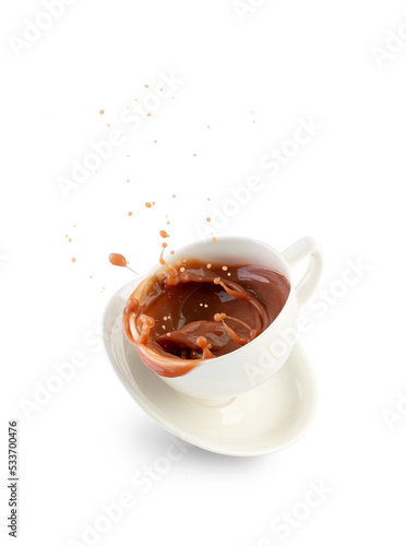 Cup with splashes of hot chocolate isolated