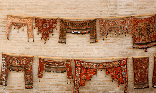 traditional Uzbek carpets on the walls of Ark of Bukhara in the Uzbekistan