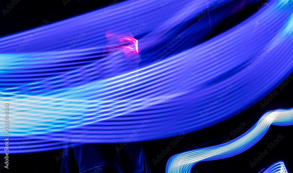 © VISTA by Westend61 - Artificial intelligence robot amidst light trail