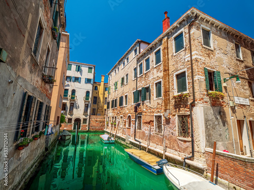 Venezia Wall Architecture along the crystal clear water canal during summer time