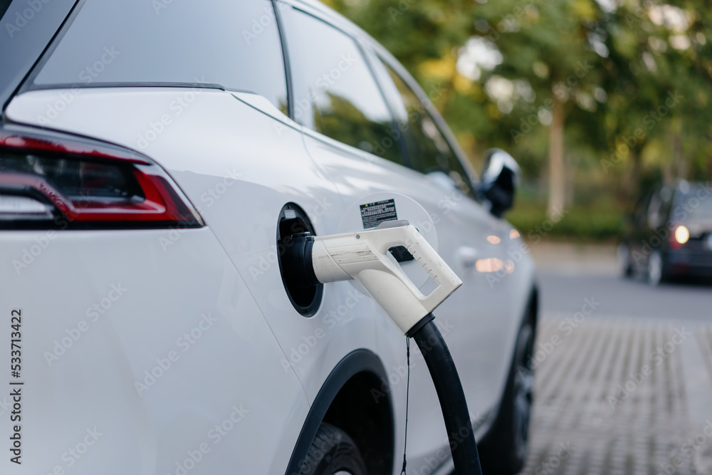 Fototapeta premium electric car charging in the station 