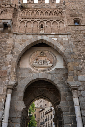 A medallion above the arch of the The Sun Gate (Spanish: Puerta del Sol) depicting the ordination of the Visigothic Ildephonsus, Toledo's patron saint, Spain