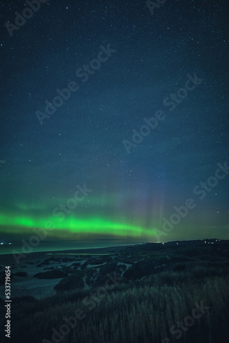 Coastline of Denmark at night with northern lights. High quality photo © Florian Kunde