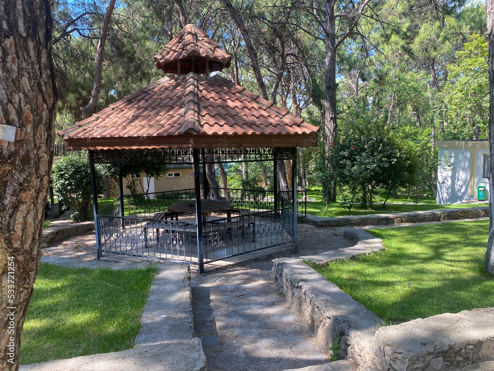Pavilions and pines in a park in Antalya