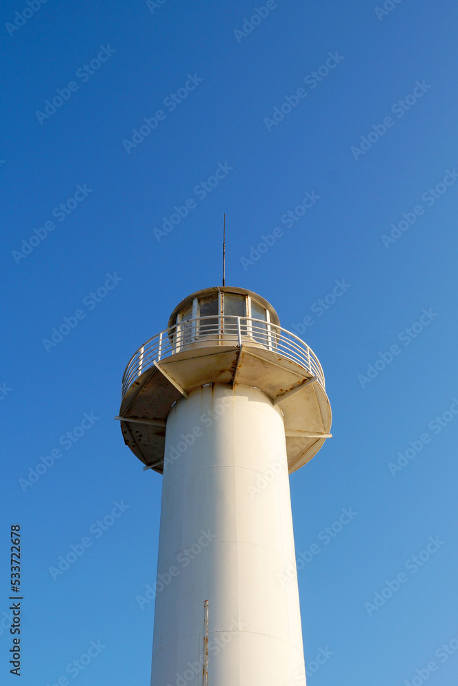 sea lighthouse tower against a clear blue sky