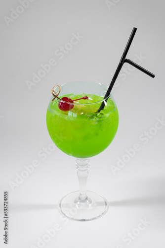 fresh green midori sour cocktail with liquor isolated photo