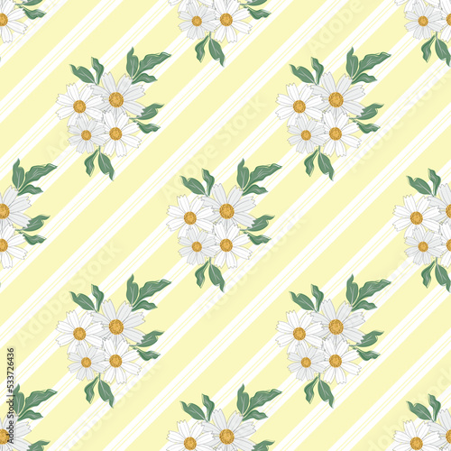 Chamomile floral seamless vector pattern background. Scattered groups of flower heads of ancient medicinal herb on yellow candy cane stripe backdrop. Botanical flora garden flowers for packaging