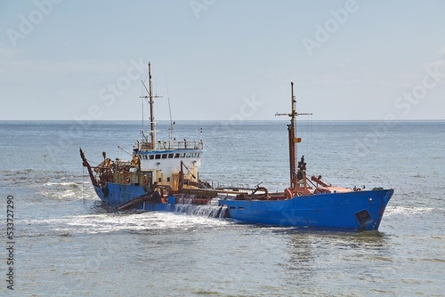 Dredging ship at a sea port