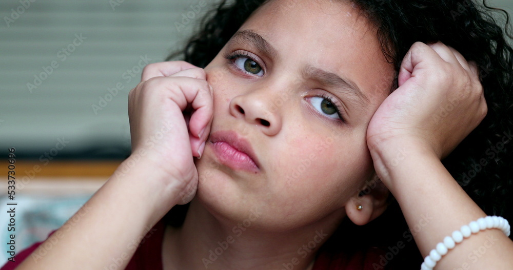 Thoughtful little girl thinking about solution to problem. Pensive child Thoughtful little girl thinking about solution to problem. Pensive child