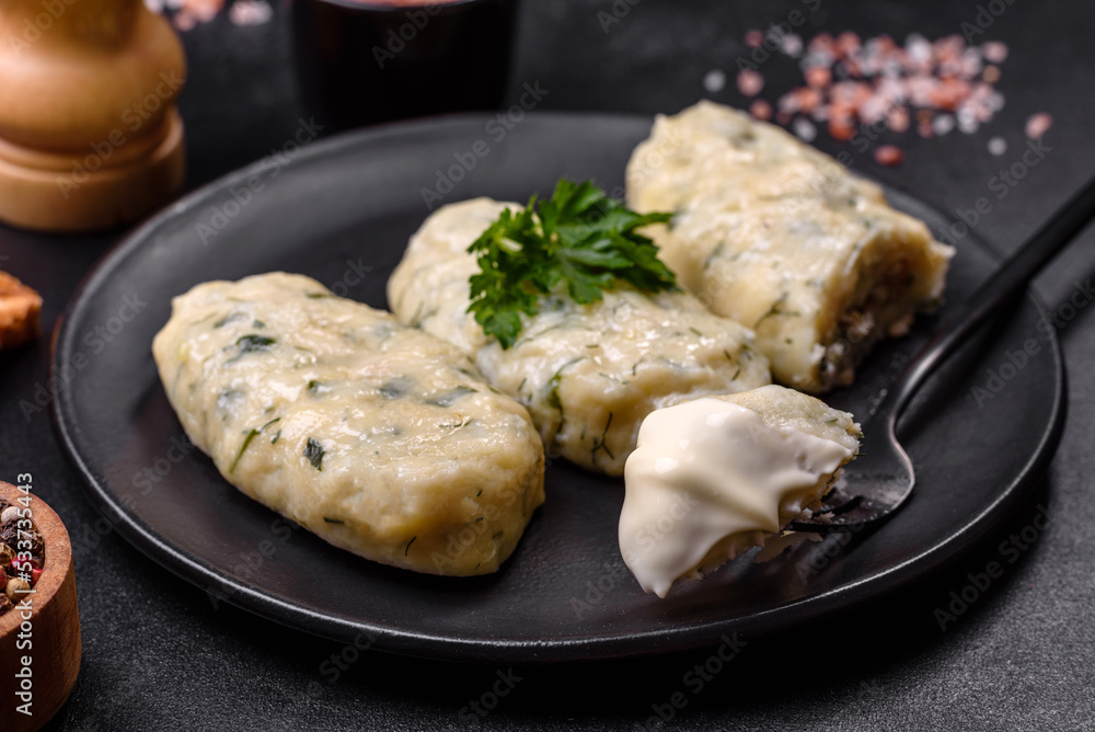 Traditional Lithuanian dish zeppelin, boiled potato dumplings stuffed with minced meat Traditional Lithuanian dish zeppelin, boiled potato dumplings stuffed with minced meat