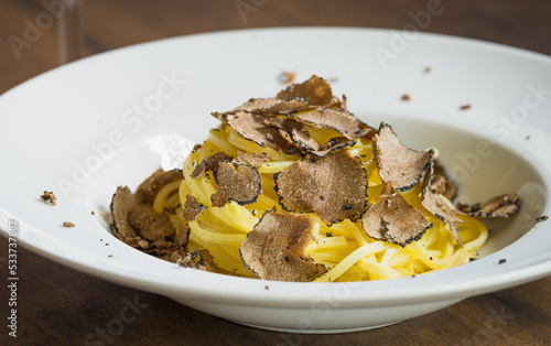Pasta with fresh truffle mushroom background.Restaurant menu plate background.