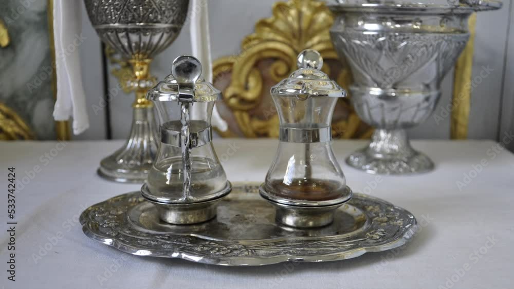 Water and Wine on Catholic Church. Religion Concept. Water and Wine on Catholic Church. Religion Concept.