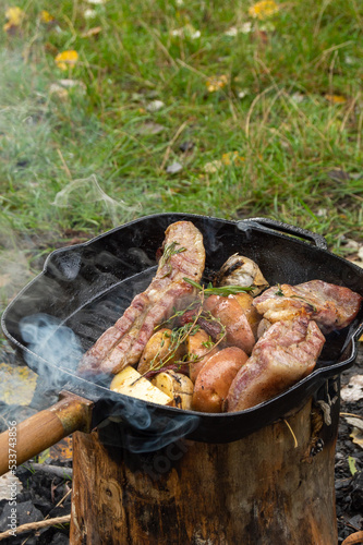 Grilled ribs with garlic peppers and herbs with potato