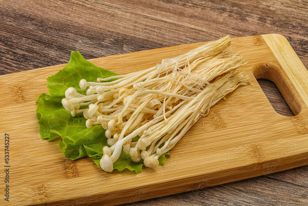 Raw Enoki mushrooms for cooking Raw Enoki mushrooms for cooking