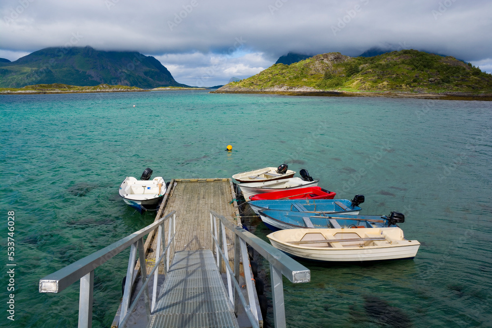 Boats moored to a jetty in Gimsoystraumen, Lofoten, Norway