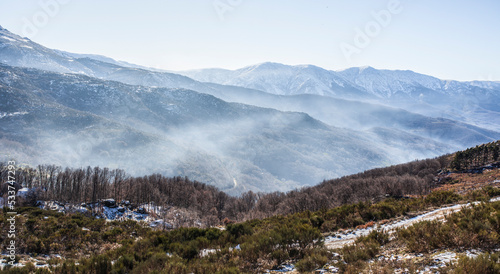 Fog running between snowy peaks of the Sierra de Gredos, Spain