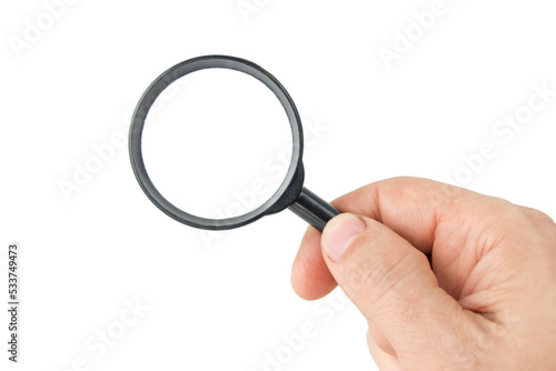 Man's hand with magnifying glass on isolated white background