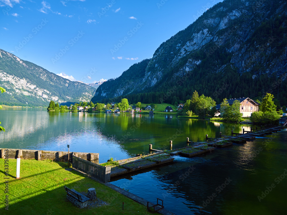 Panoramic mountain landscape of Hallstatt lake at sunny day in Austrian Alps, Salzkammergut region.