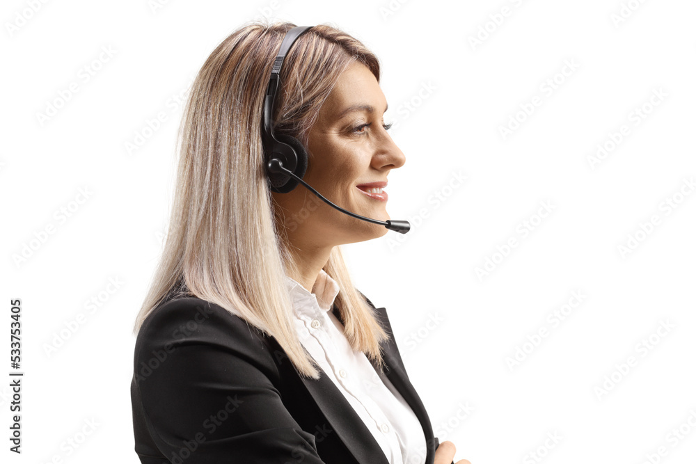 Profile shot of a young female dispatcher with a headset and microphone Profile shot of a young female dispatcher with a headset and microphone