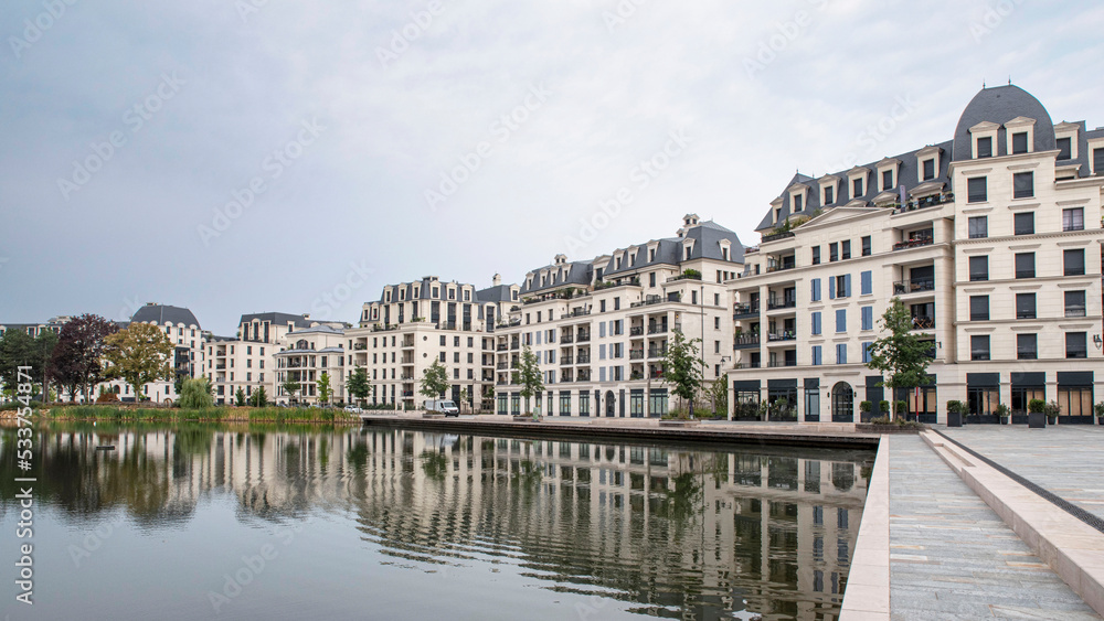 Modern architecture of apartment buildings in a residential area on a lake 