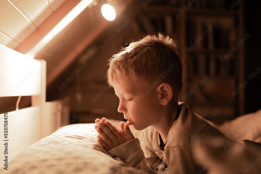 Little boy praying in bed before sleep Stock Photo Adobe Stock