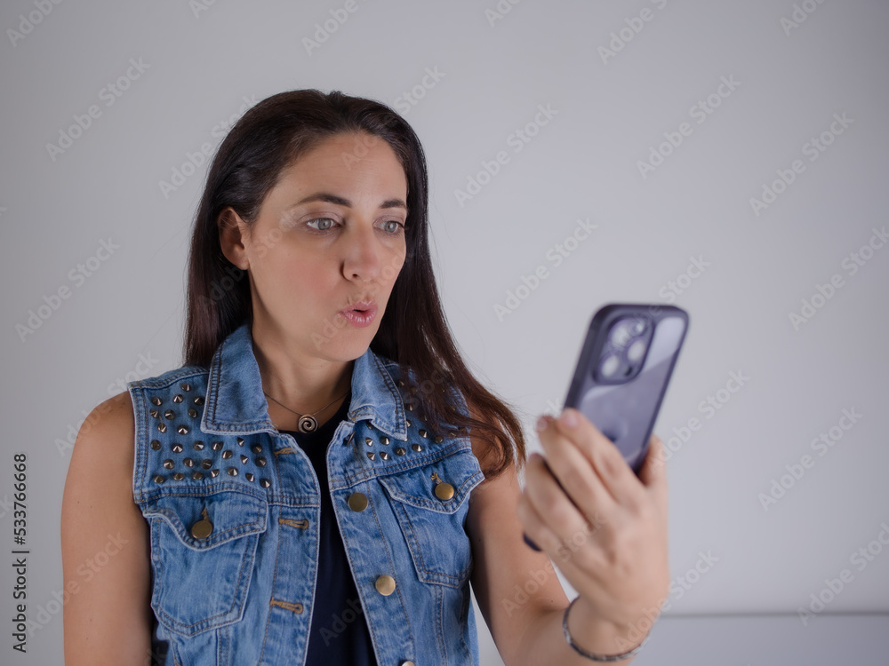 woman talking on the phone and making expression woman talking on the phone and making expression