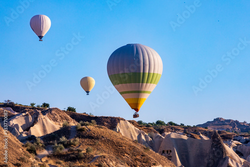 beautiful view of hot air balloon flights in the early morning in the blue sky in the Goreme valley