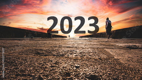 Happy New Year 2023 anniversary. Transition from 2022 to new year. New year concept with the year 2023 text on distant. High resolution photo for large displays  print  banners  social media posts.