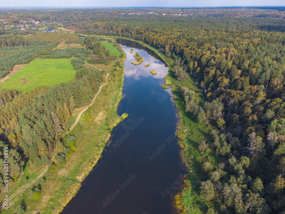 Flight over the river, river in the forest from a bird eye view