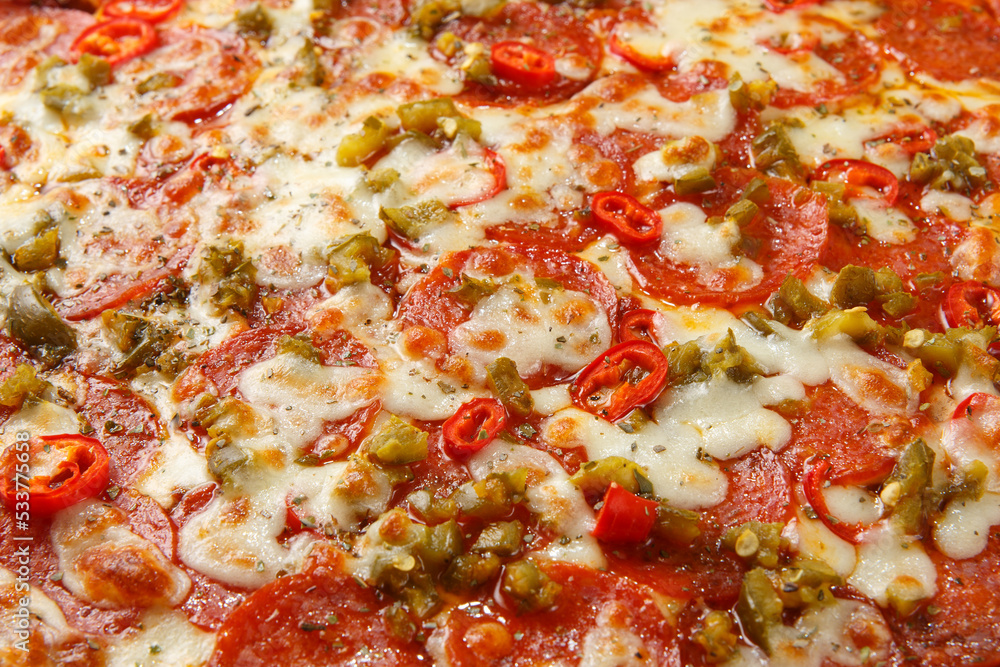 Pizza background - macro shot of spicy italian pizza. Pizza background - macro shot of spicy italian pizza.