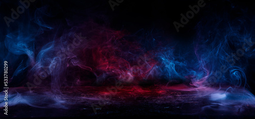 Fototapeta Naklejka Na Ścianę i Meble -  Panoramic view of the abstract fog. Red and blue cloudiness, mist or smog moves on black background. Beautiful swirling blue smoke. Mockup for your logo. Wide angle horizontal wallpaper or web banner.