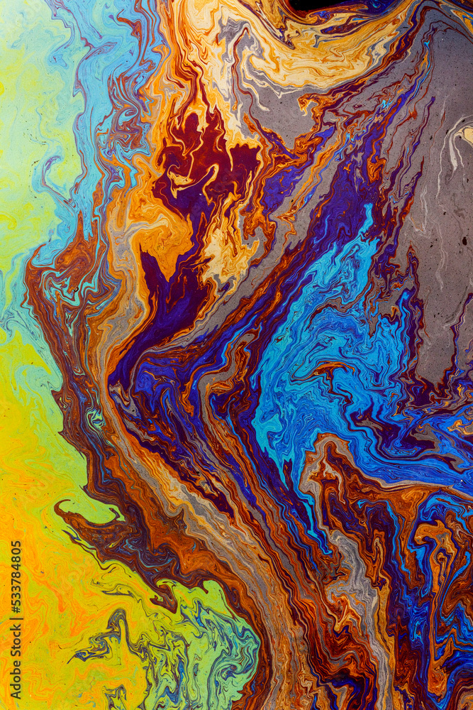 Abstract pattern in oil spilled in small stream, Costa Rica