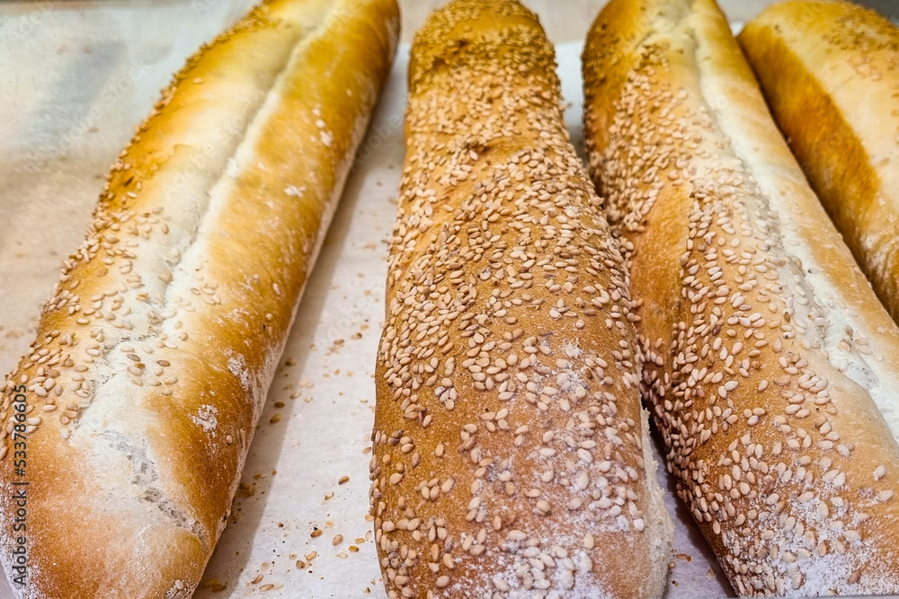 Fresh tasty baguette with sesame seeds. Fresh tasty baguette with sesame seeds.