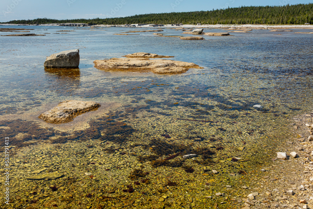 Monoliths under a beautiful blue sky in Mingan Archipelago National Park Reserve of Canada, Quebec, Canada Monoliths under a beautiful blue sky in Mingan Archipelago National Park Reserve of Canada, Quebec, Canada