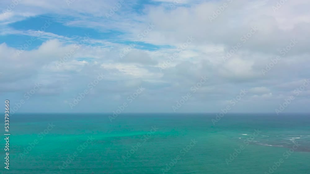 Blue ocean with waves and sky with clouds, seascape top view. Water cloud horizon background. Blue sea water with waves against sky. Blue ocean with waves and sky with clouds, seascape top view. Water cloud horizon background. Blue sea water with waves against sky.