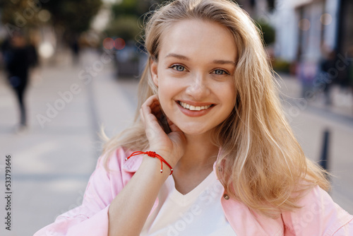 young pretty blond woman portrait outdoor