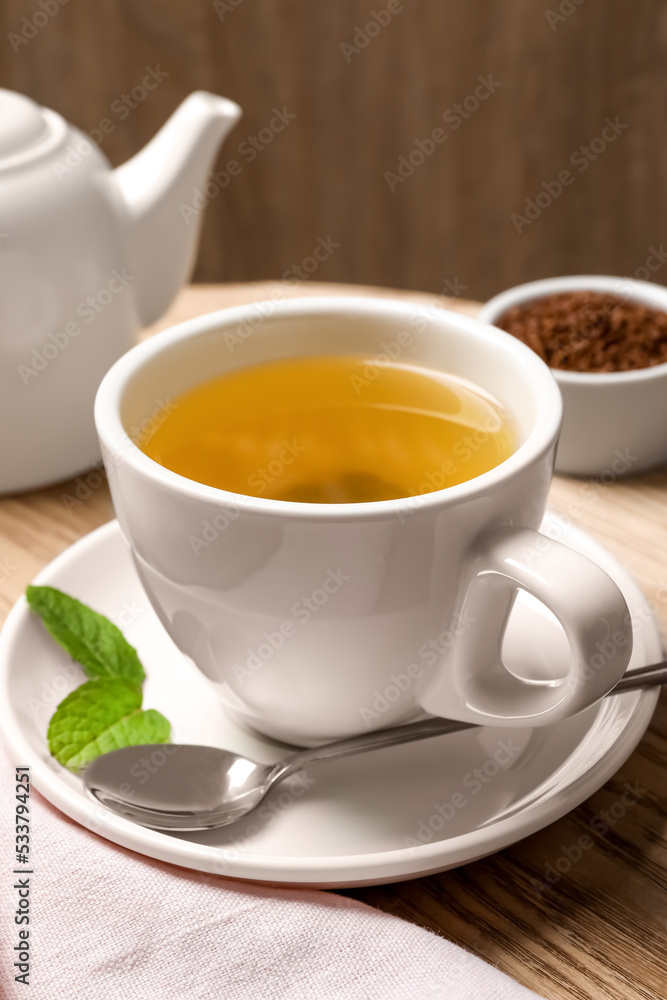 Freshly made buckwheat tea on wooden table, closeup Freshly made buckwheat tea on wooden table, closeup