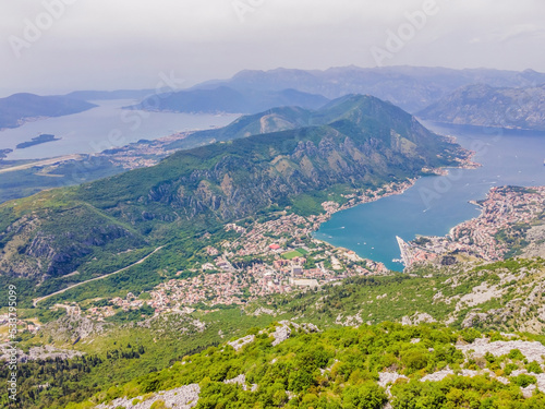 Beautiful nature mountains landscape. Kotor bay, Montenegro. Views of the Boka Bay, with the cities of Kotor and Tivat with the top of the mountain, Montenegro Portrait of a disgruntled girl sitting