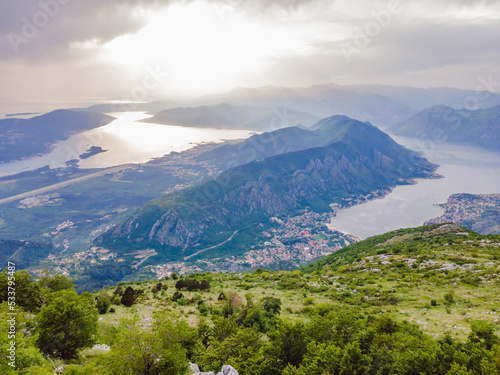 Beautiful nature mountains landscape. Kotor bay, Montenegro. Views of the Boka Bay, with the cities of Kotor and Tivat with the top of the mountain, Montenegro Portrait of a disgruntled girl sitting
