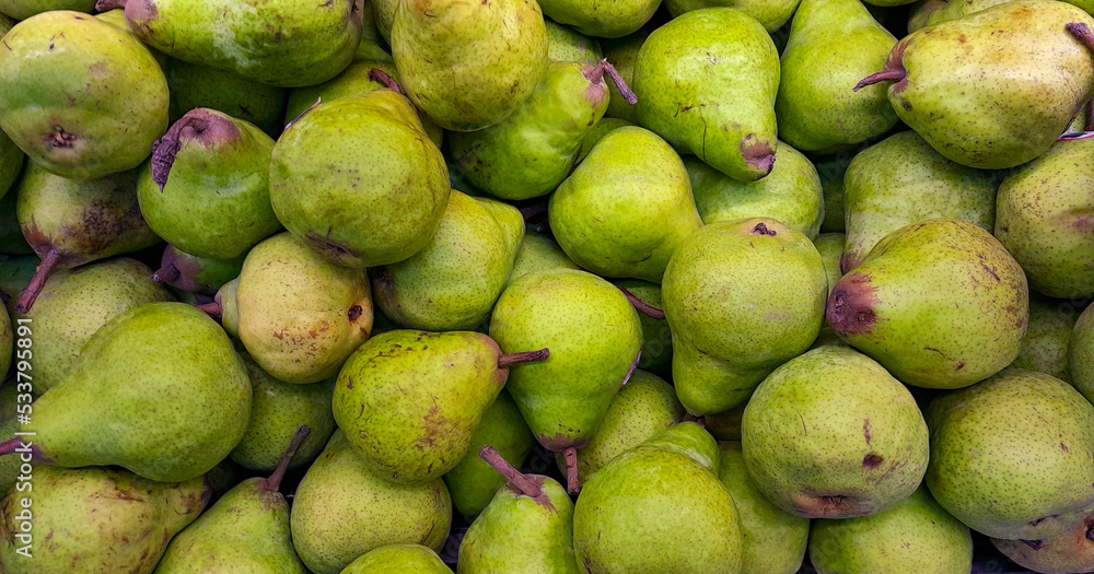 stack of pears on the supermarket shelf stack of pears on the supermarket shelf